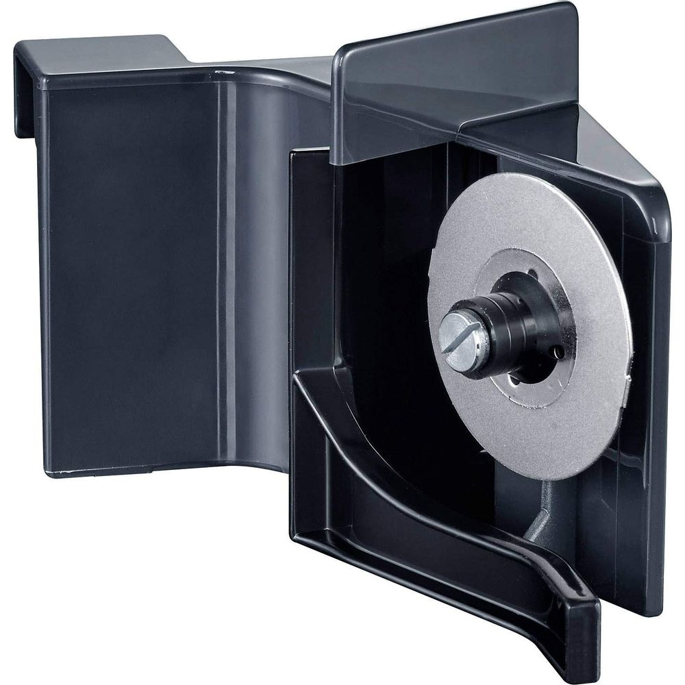Un support en plastique noir avec un disque métallique rond et vis.