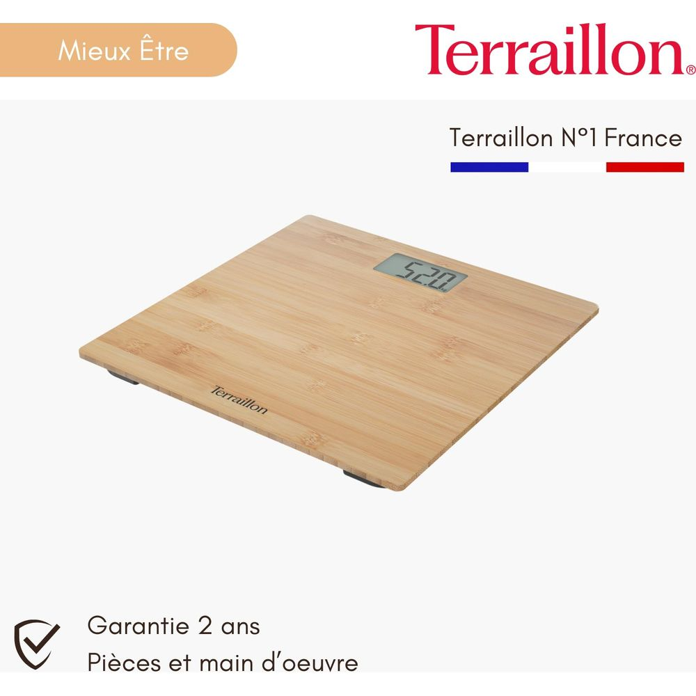 Drewniana waga cyfrowa pokazująca 52.0. 'Mieux Être' znajduje się w lewym górnym rogu.