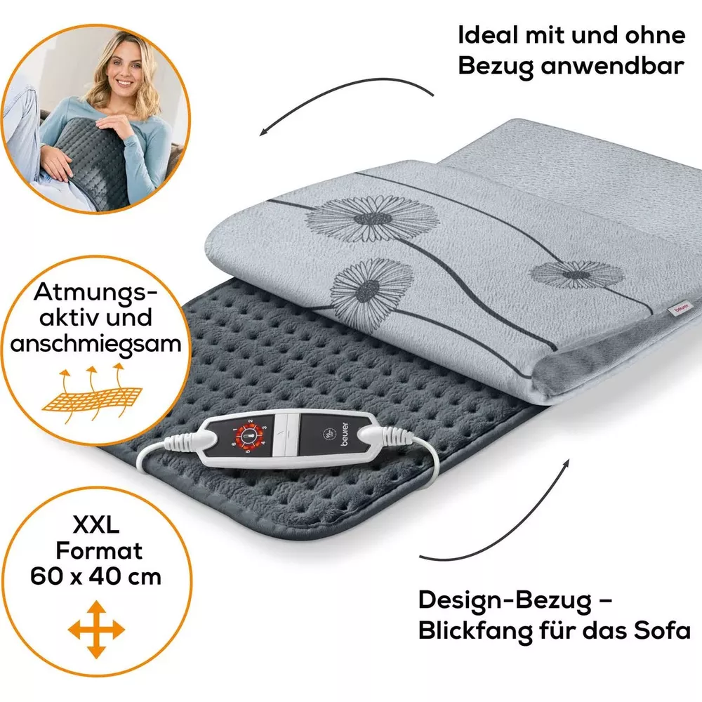 Graues Heizkissen mit floralem Bezug, Fernbedienung und Größenangabe.