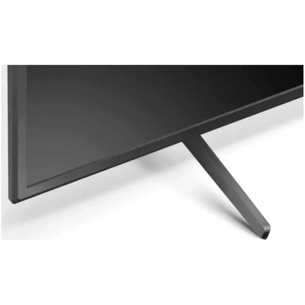 Uno schermo TV scuro con un unico piedistallo grigio.