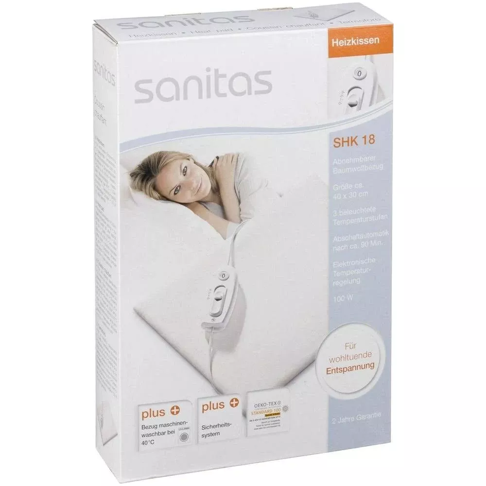 Verpackung eines Sanitas Heizkissens SHK 18 mit Frau auf weißem Kissen.