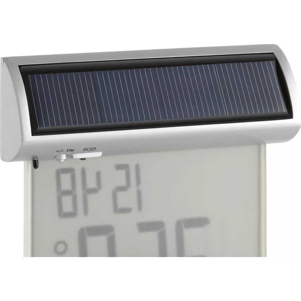 Ein silbernes Gehäuse mit Solarpanel über einem digitalen Display mit Zahlen.