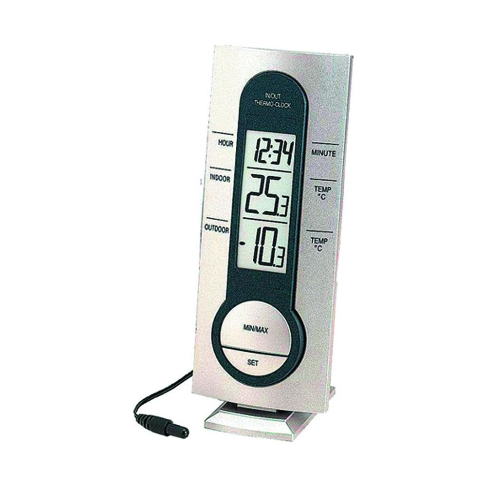 Cyfrowy termometr-zegar pokazuje 12:34, 25,3°C wewnątrz i 10,3°C na zewnątrz.