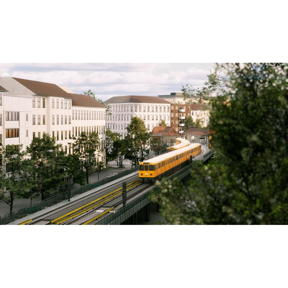Ein gelber Zug fährt auf erhöhten Schienen an weißen Gebäuden vorbei.