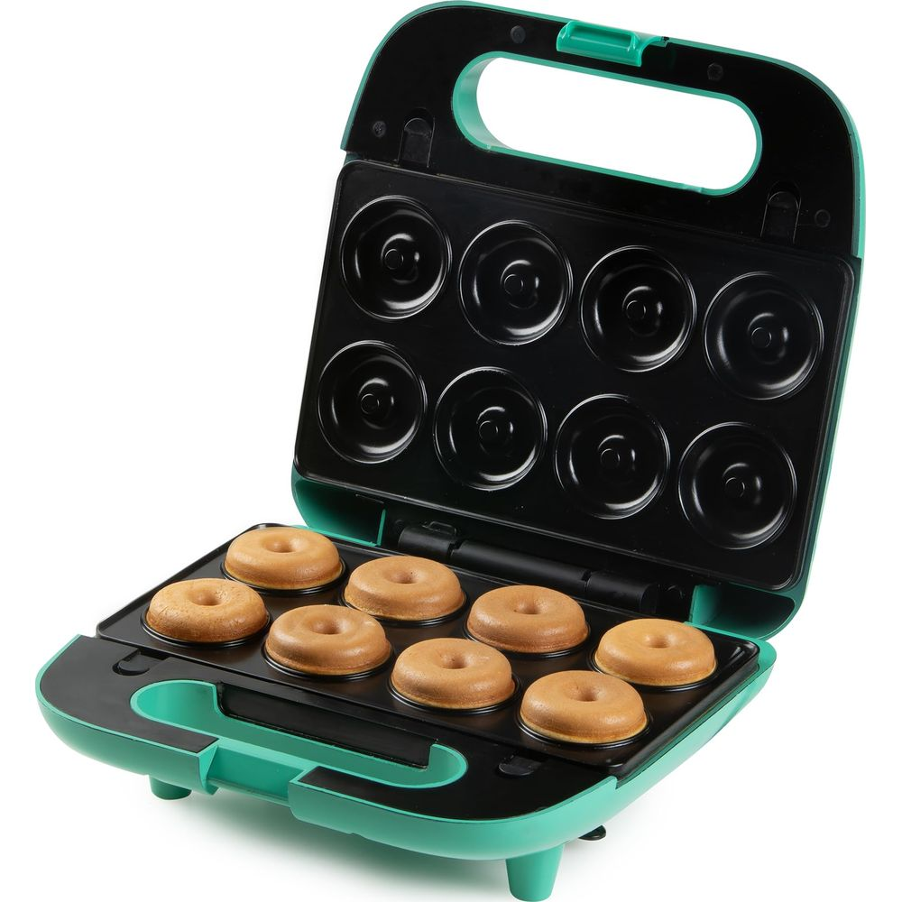 Grünes Donut-Gerät mit acht gebackenen Donuts auf der unteren Platte.