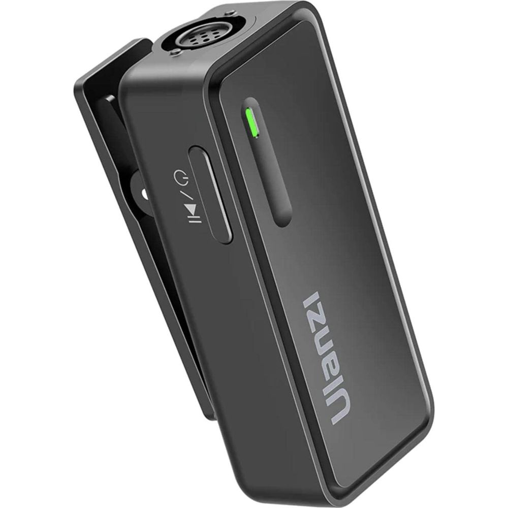 Émetteur microphone noir avec clip, port micro, port de charge et indicateur LED vert.
