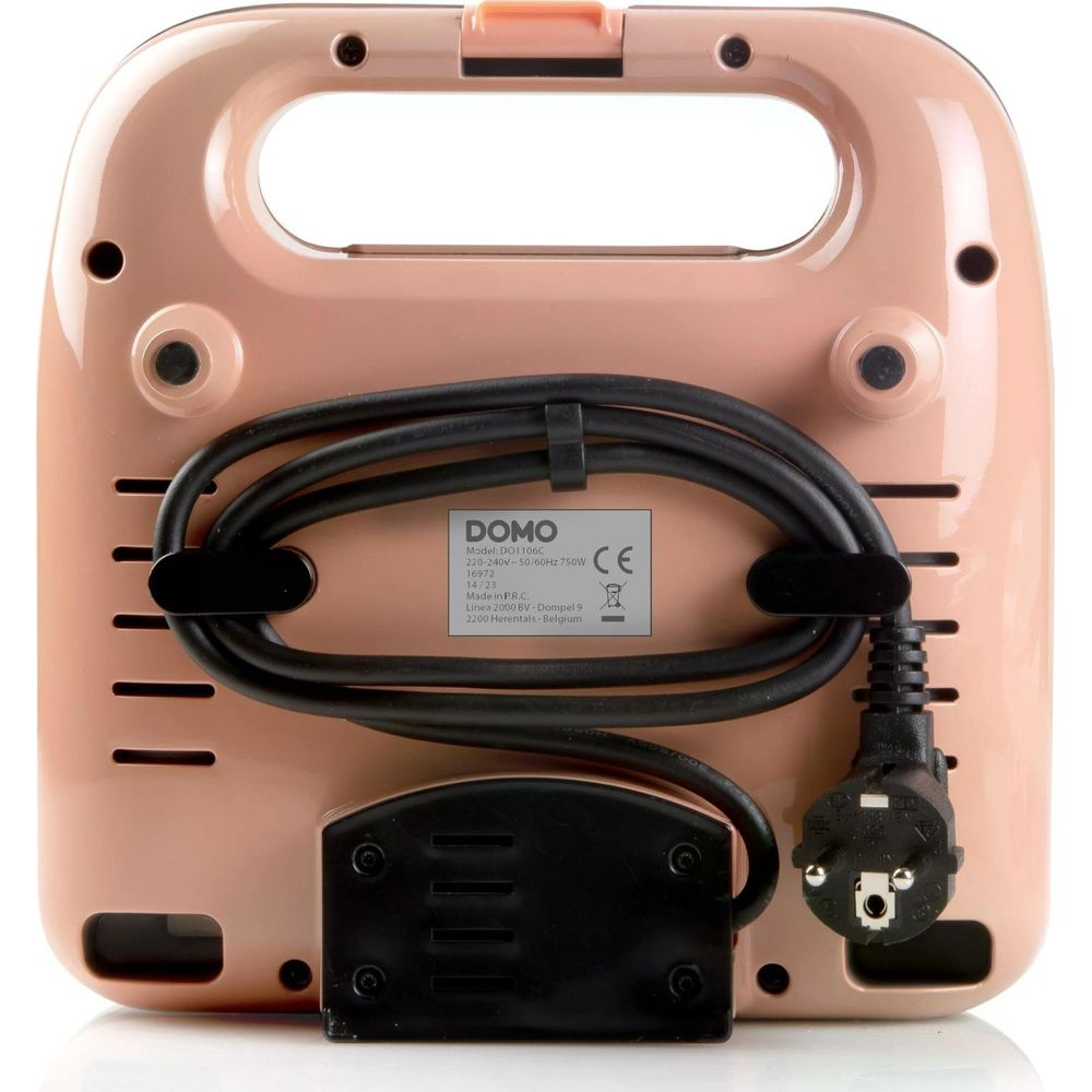 Retro di un sandwich maker rosa con cavo ed etichetta