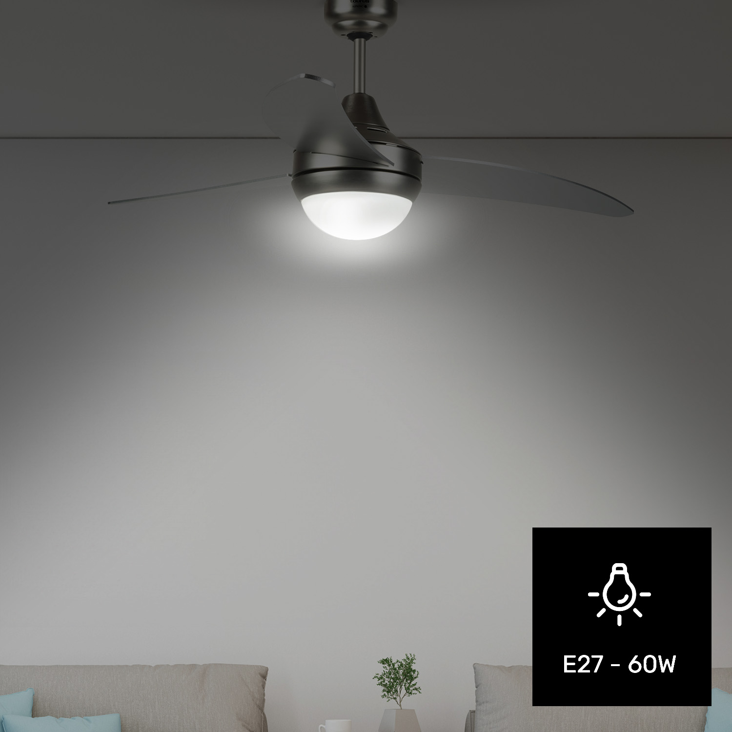 Un ventilador de techo oscuro con luz sobre un sofá.