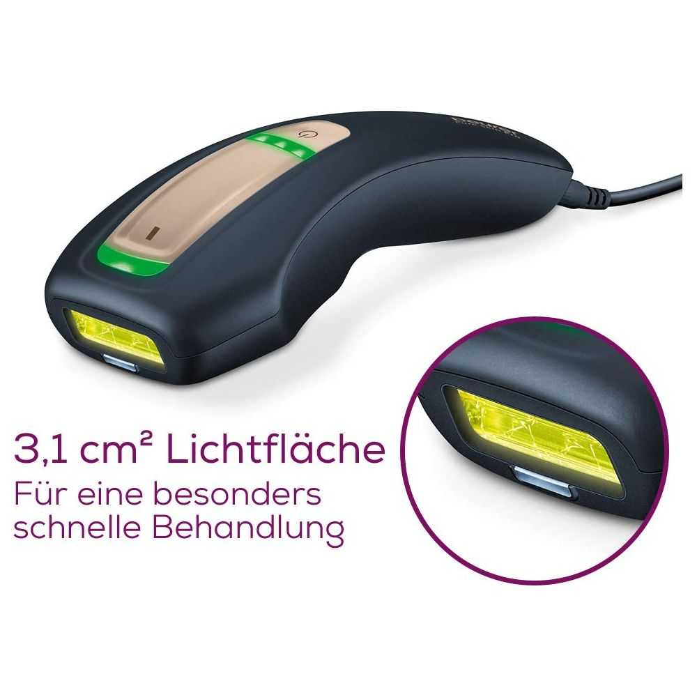 Ein dunkles Haarentfernungsgerät mit gelbem Licht und grünen Bedienelementen.