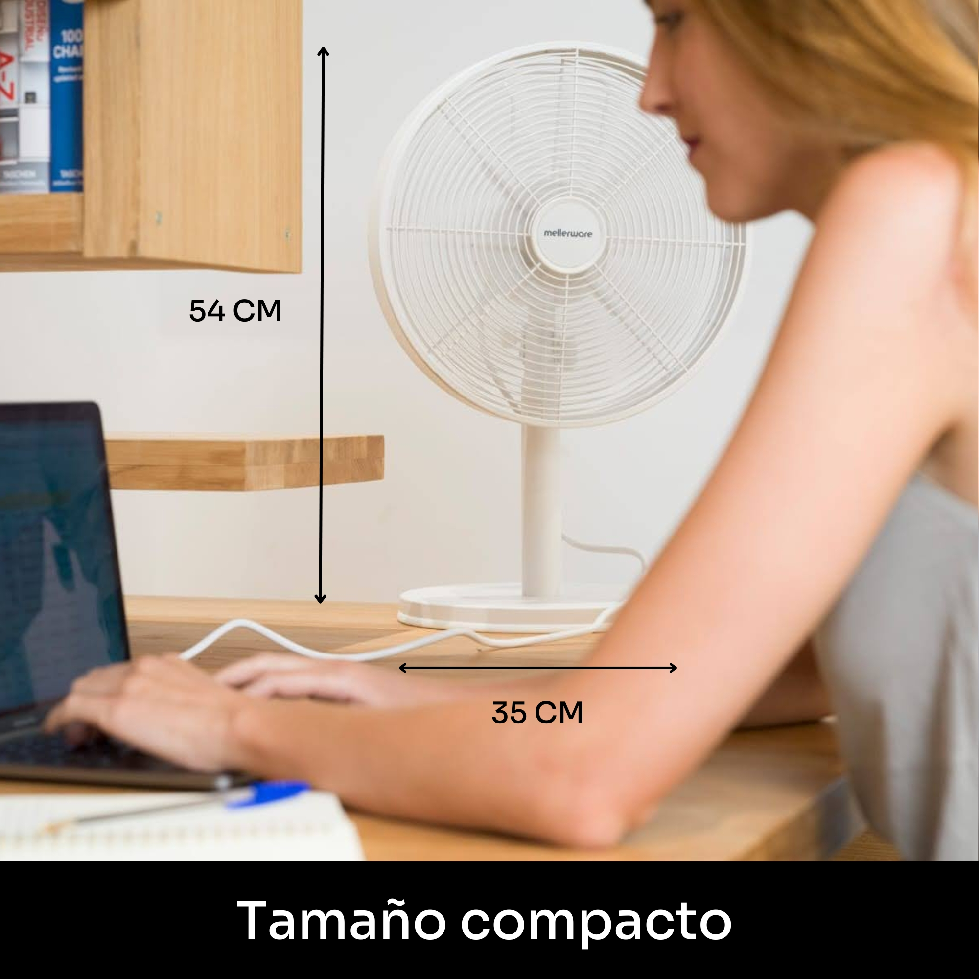 Un ventilador blanco junto a una persona escribiendo en un portátil. Dimensiones.