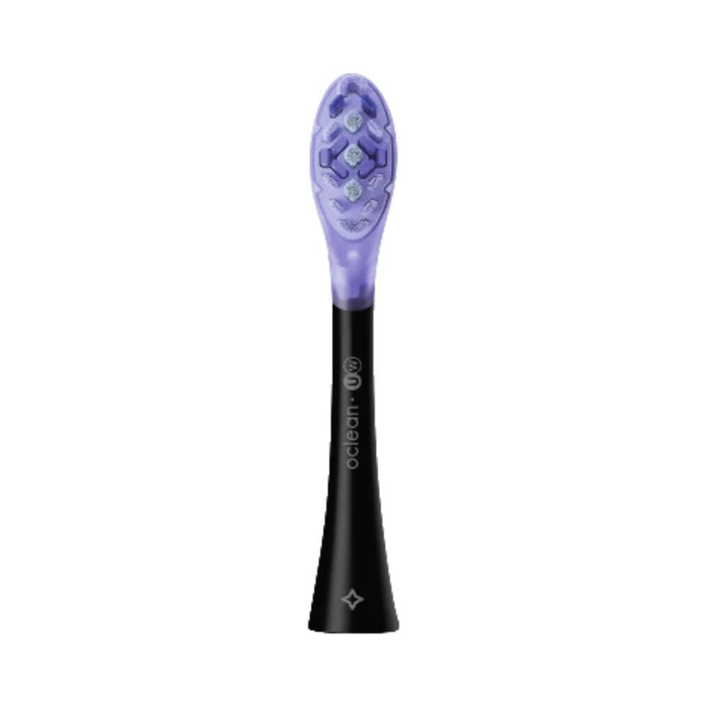 A purple brush head with a black handle standing on a white background.