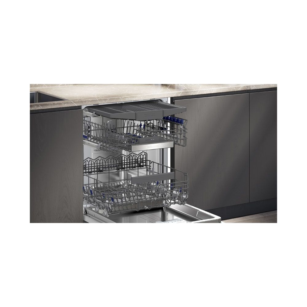 An open dishwasher with three racks and a cutlery drawer.