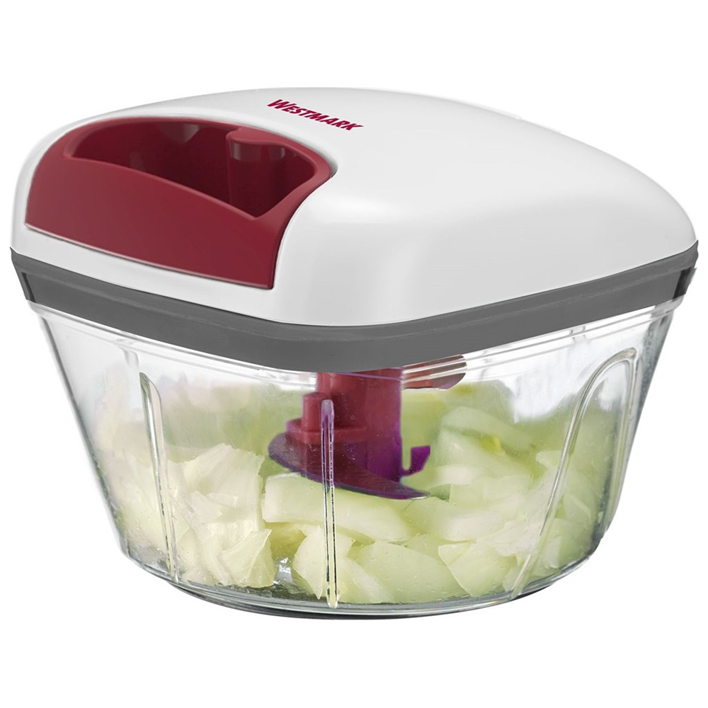 Un tritatutto da cucina bianco e rosso con cipolle tritate nel contenitore trasparente.