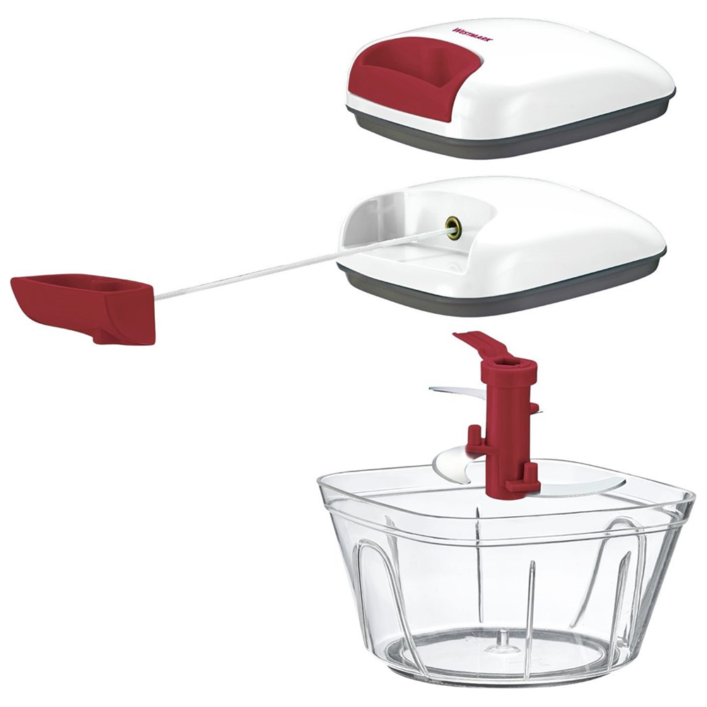 Un tritatutto manuale bianco e rosso con i suoi componenti esposti.