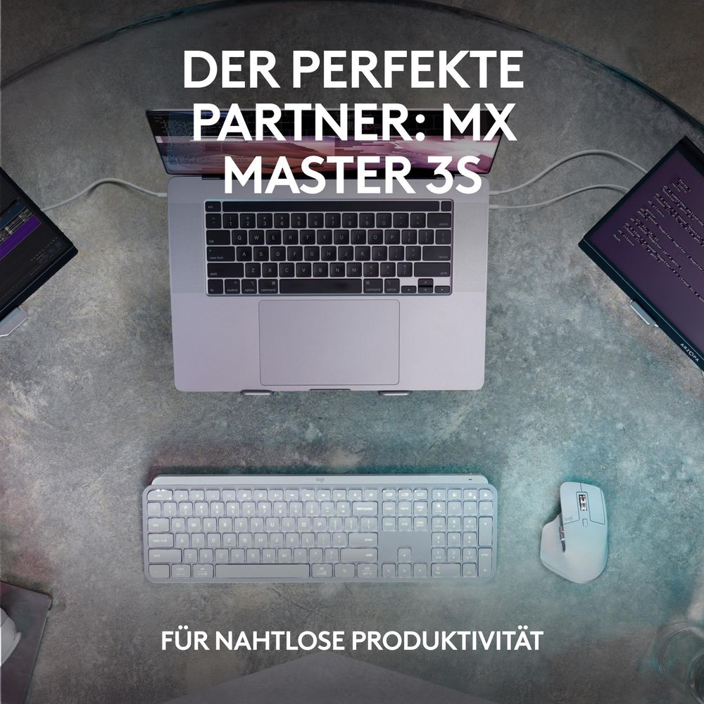 Laptop, klawiatura i mysz na stole. Tekst: IDEALNY PARTNER: MX MASTER 3S