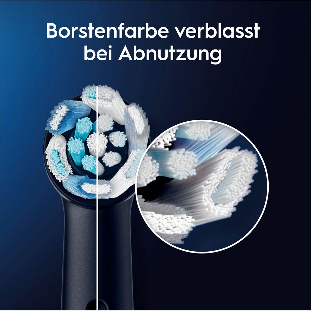 Zahnbürstenkopf zeigt verblasste blaue Borsten bei Abnutzung.