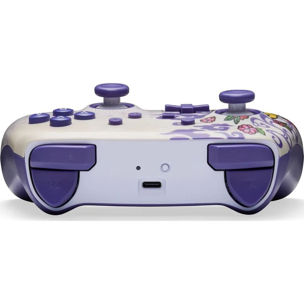Lila und weiße Gaming-Controller mit Blumenmuster und Knöpfen.
