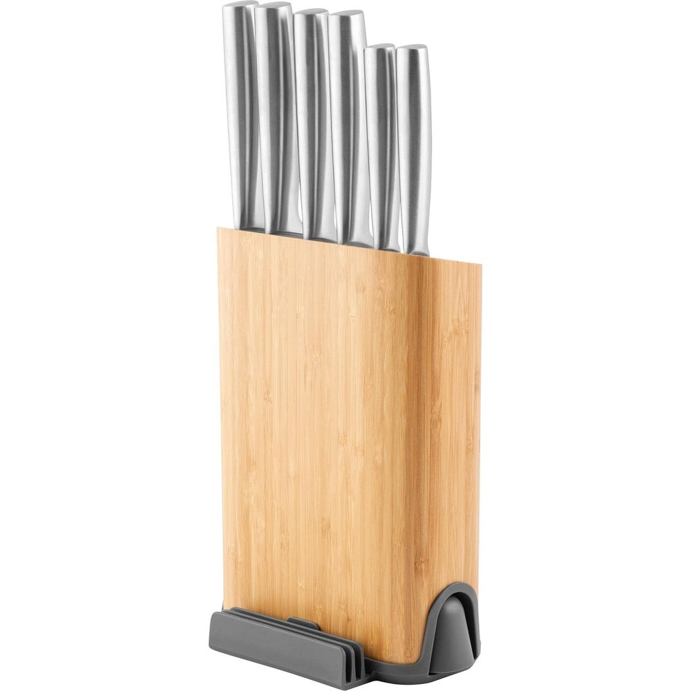 A wooden knife block holding five silver knives.