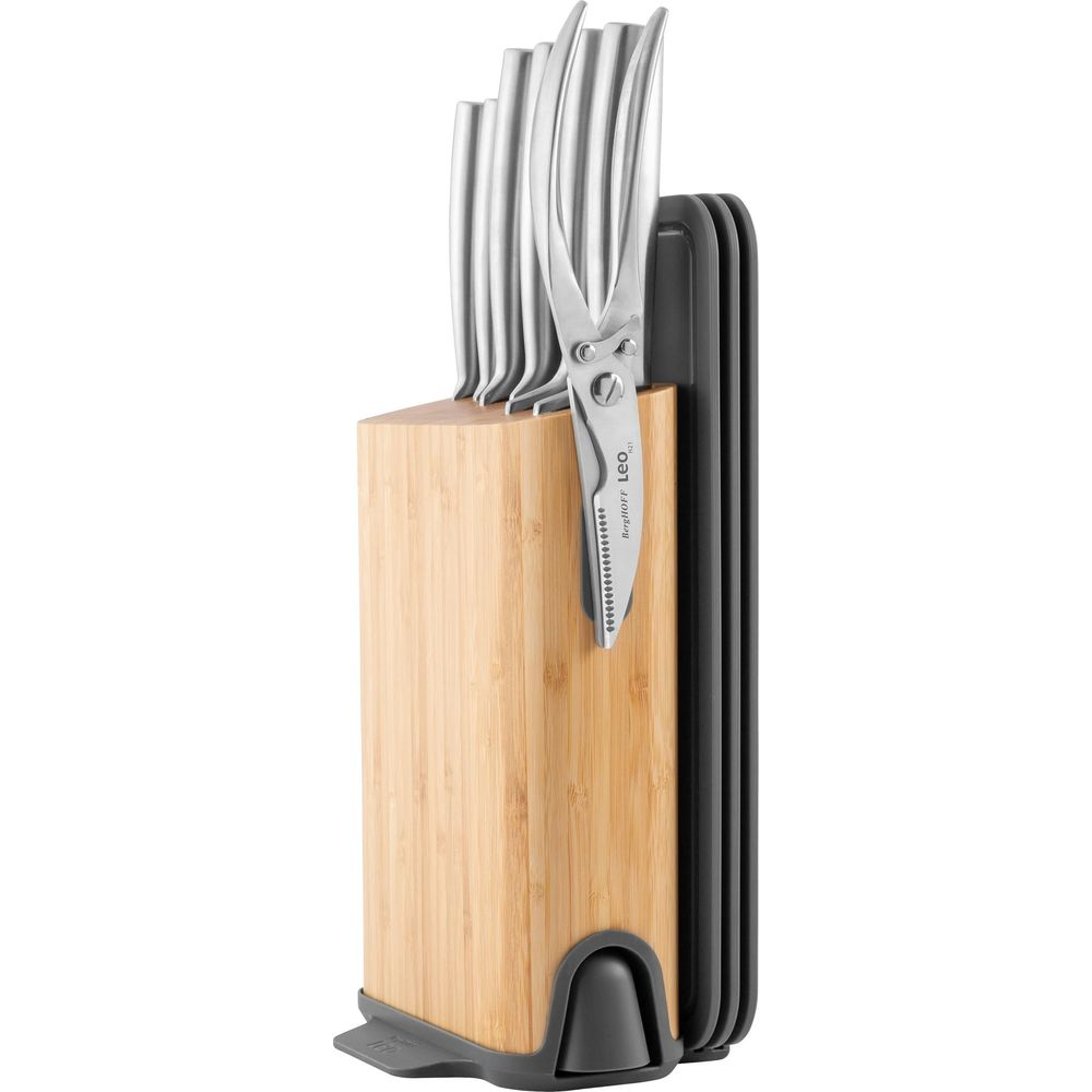 A wooden knife block with silver knives and scissors. Scissors read BergHOFF LEO.