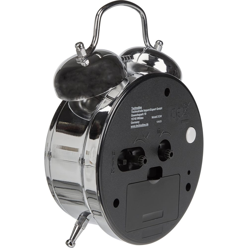 Błyszczący budzik z dwoma dzwonkami i metalowym uchwytem. Z tyłu znajdują się przyciski sterujące.