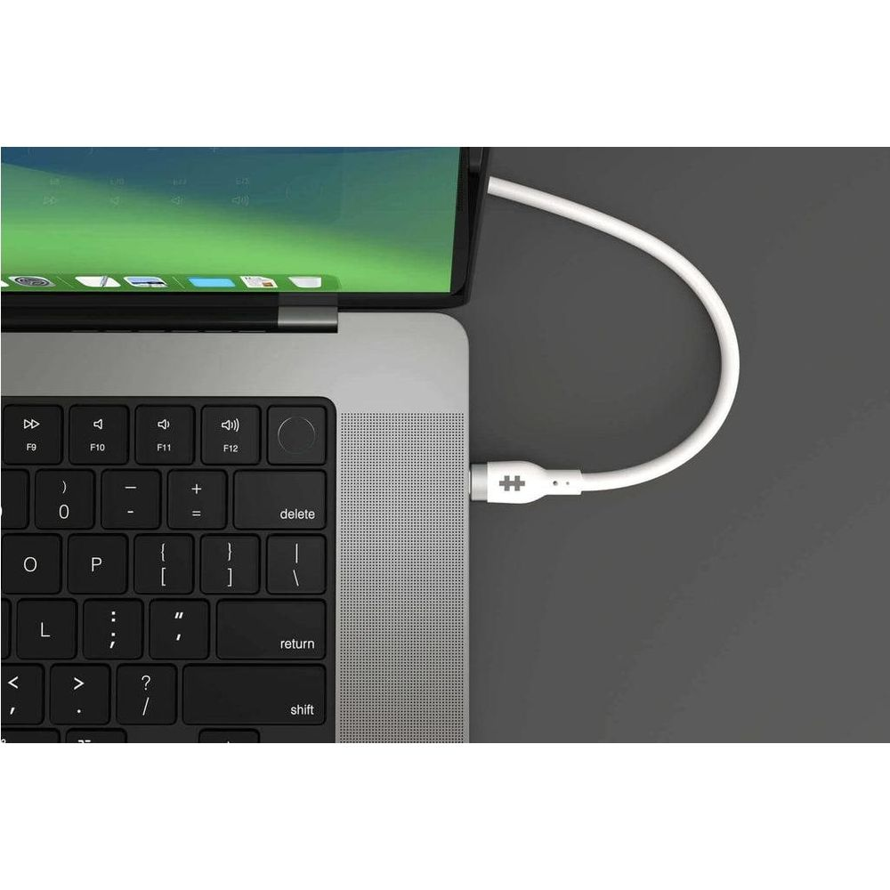 A white USB-C cable is plugged into a laptop.