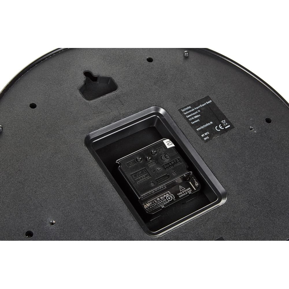 Rückseite einer Uhr mit Batteriefach und Quarzwerk.