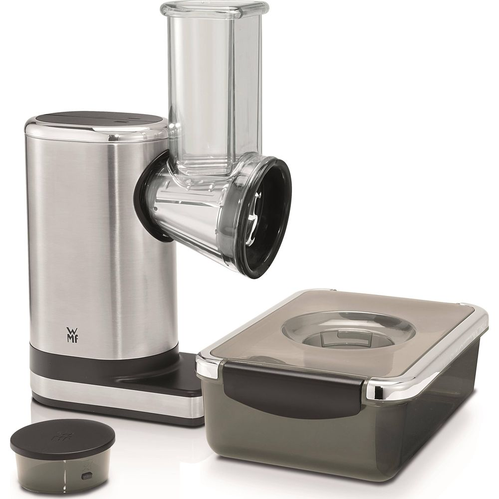 Affetta verdure elettrico argento con accessorio trasparente e contenitore grigio.