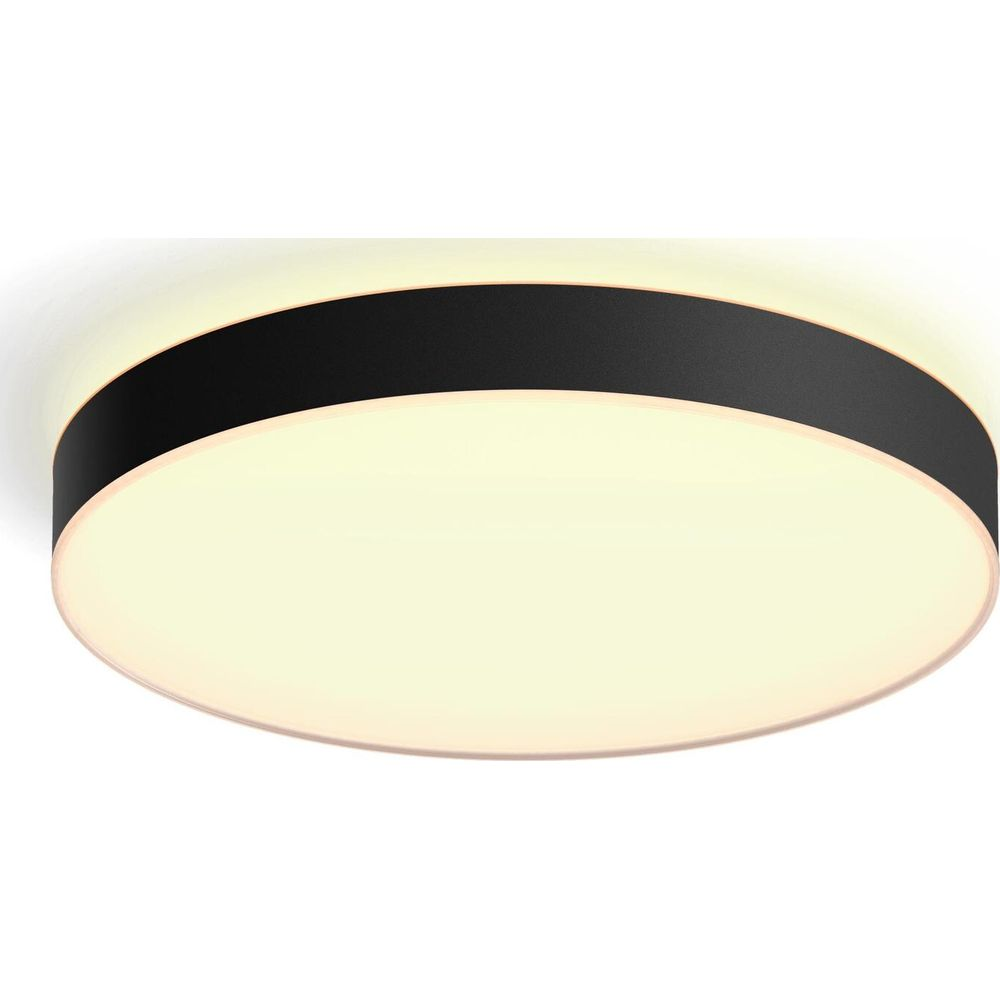 Okrągła lampa sufitowa z czarną ramką i ciepłym białym światłem.