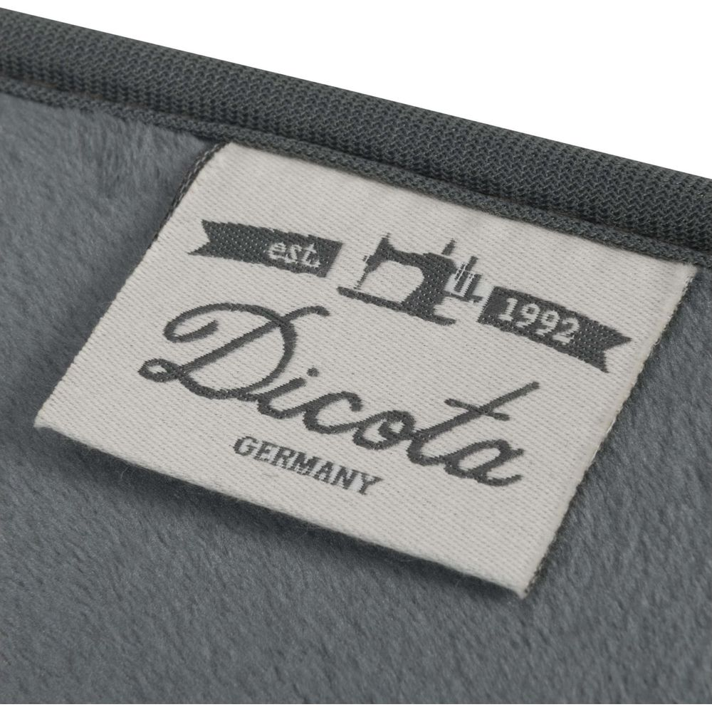 Graues Etikett mit Dicota-Logo, Nähmaschine, 1992 und Germany.