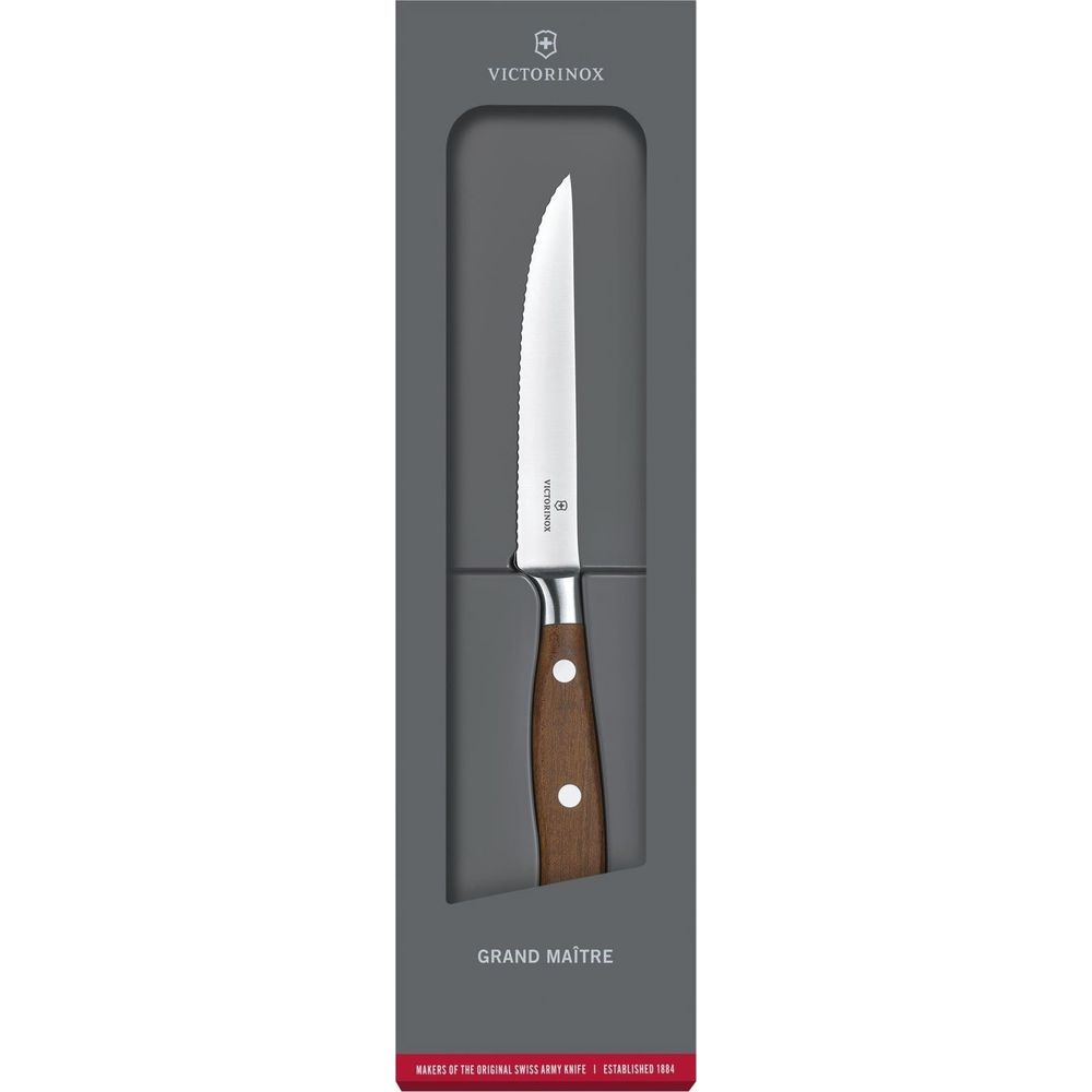 Ein Victorinox Grand Maitre Messer mit Holzkgriff in Geschenkverpackung.