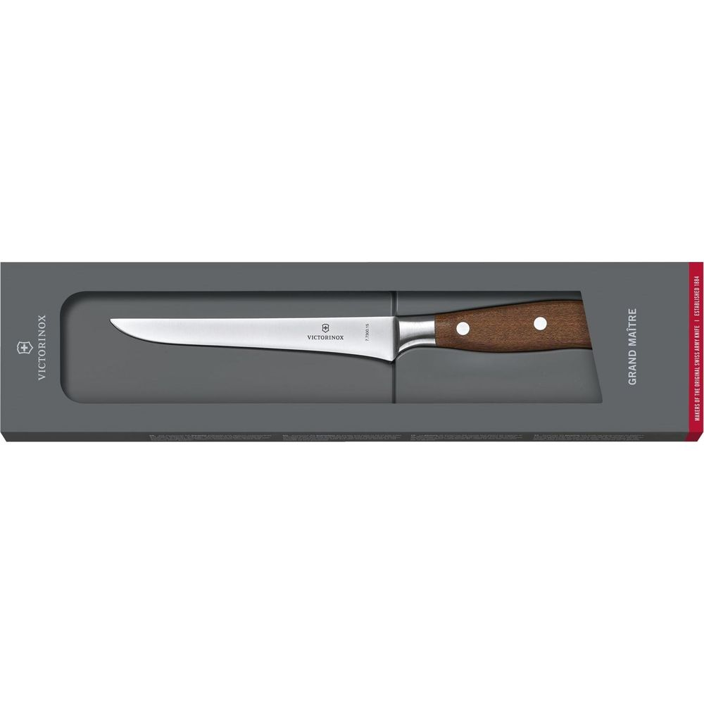 Ein Victorinox Grand Maître Kochmesser mit Holzgriff in einer grauen Verpackung.