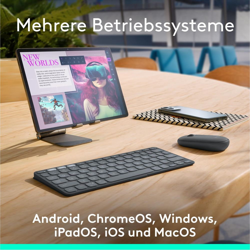 Scrivania con tablet, tastiera, mouse e telefono. Molteplici sistemi operativi.