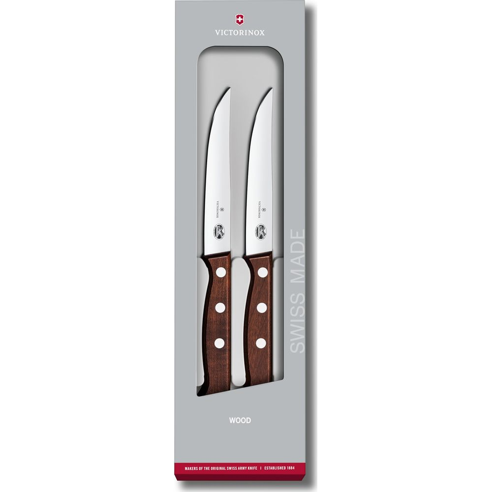 Deux couteaux Victorinox avec manches en bois dans un emballage.