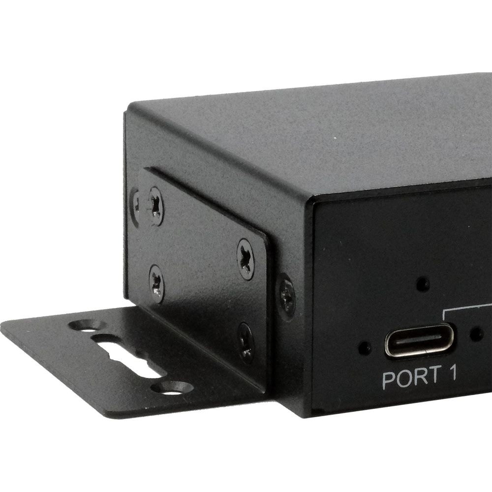 Scatola nera con porta USB-C etichettata PORT 1 e staffa di montaggio.