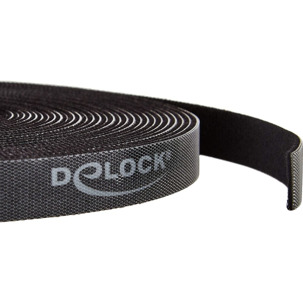 Bande velcro noire avec logo Dolock blanc, enroulée sur fond blanc.