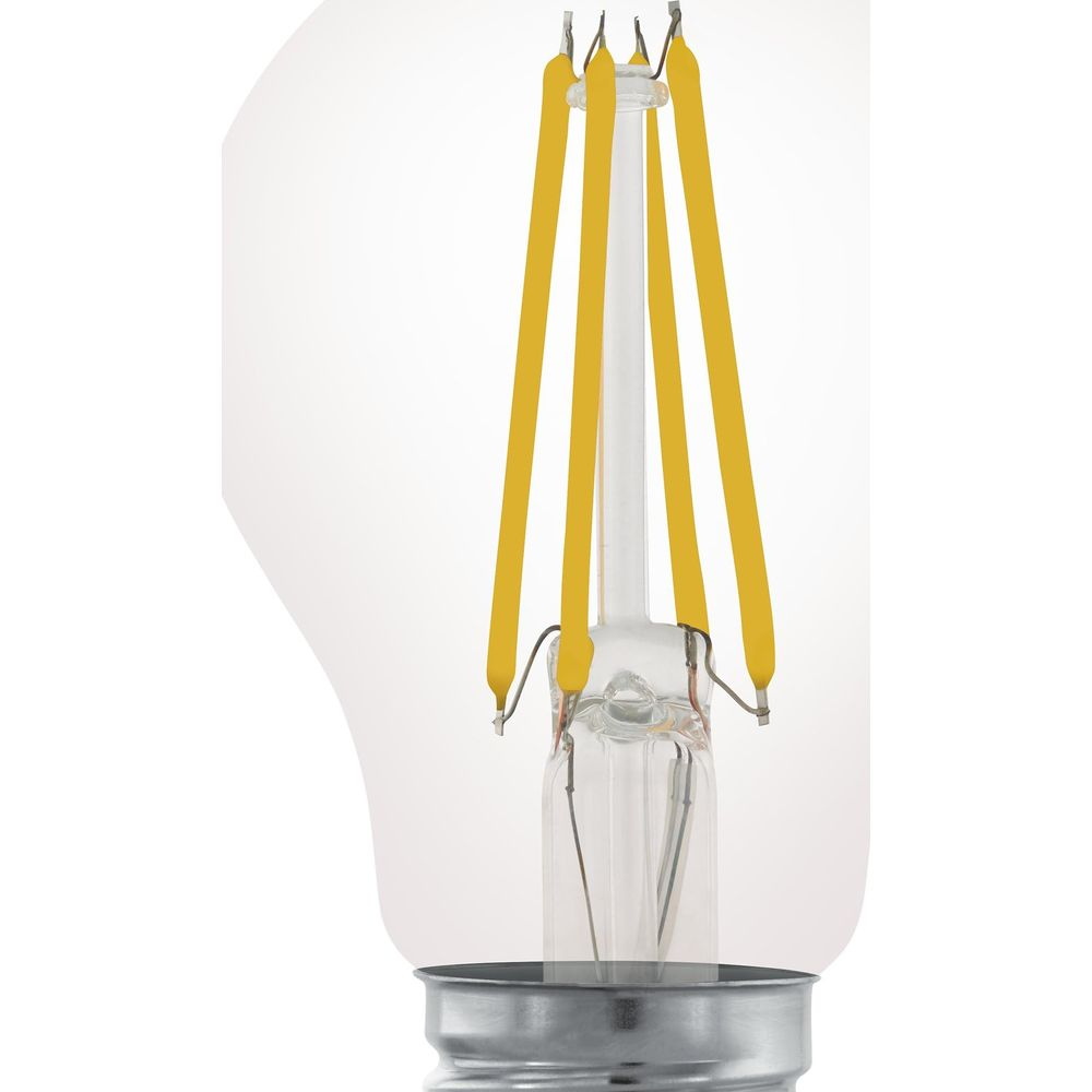 Gros plan d'une ampoule avec filaments jaunes et ampoule en verre clair.