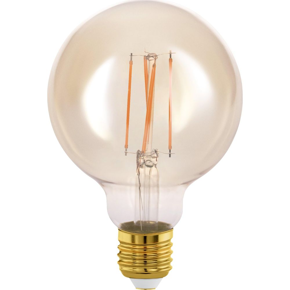 Una lampadina trasparente con base dorata e filamenti visibili.