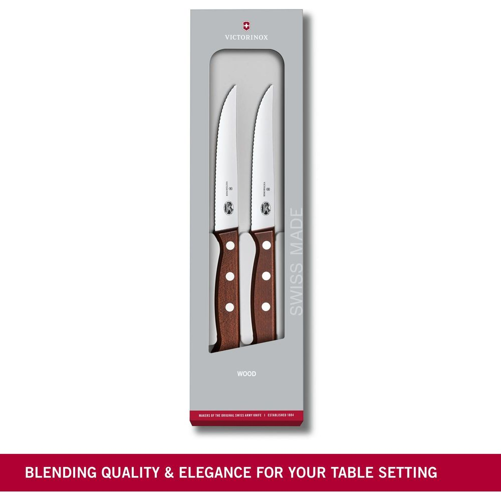 Deux couteaux Victorinox avec manches en bois dans un emballage.