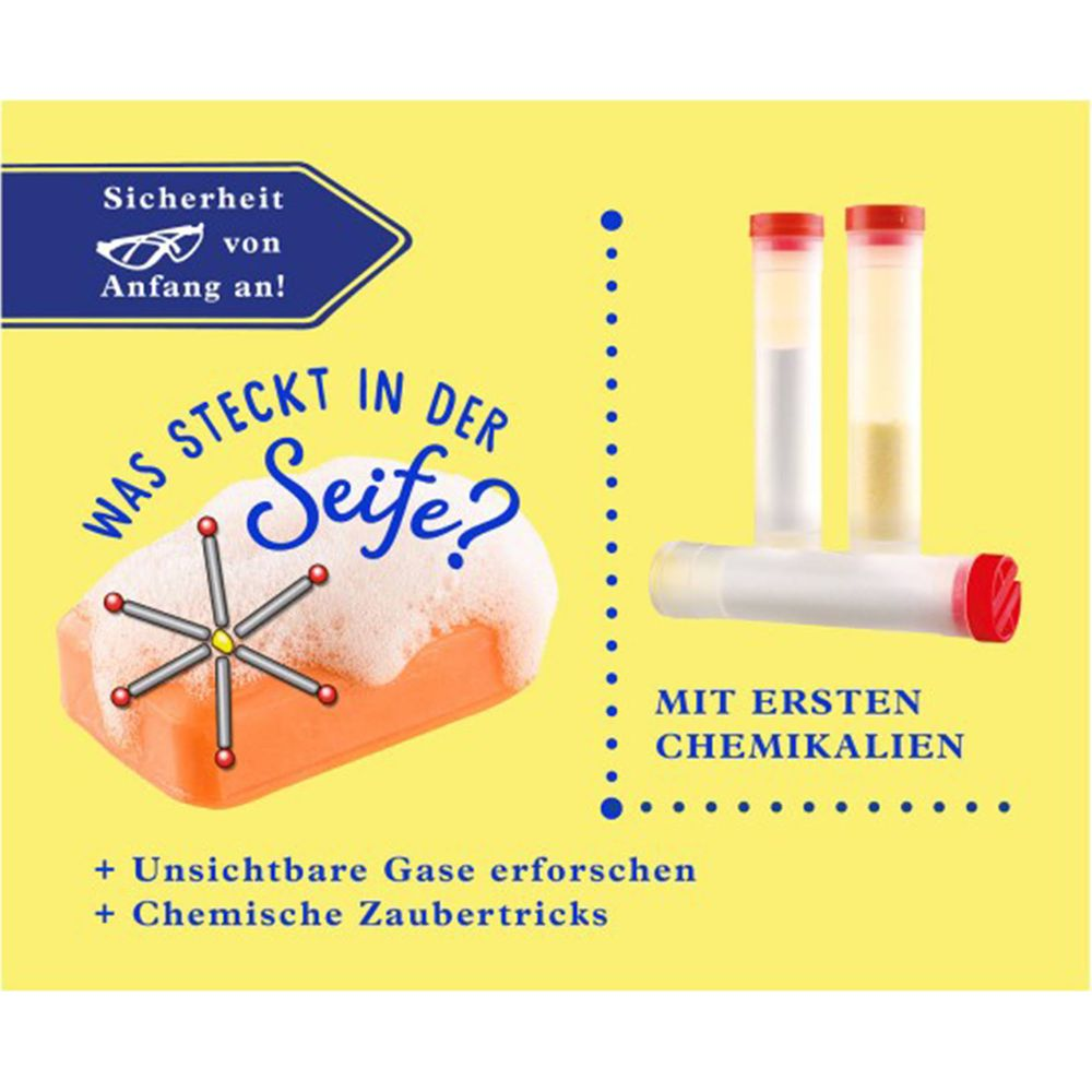 Orange Seife mit Schaum, Reagenzgläser und chemische Symbole.