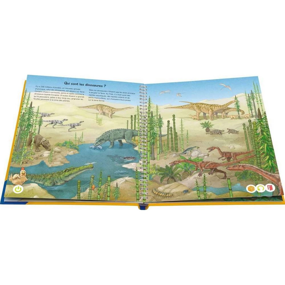 Un libro aperto su un'illustrazione di dinosauri: coccodrillo, polli, raptor, brontosauro.