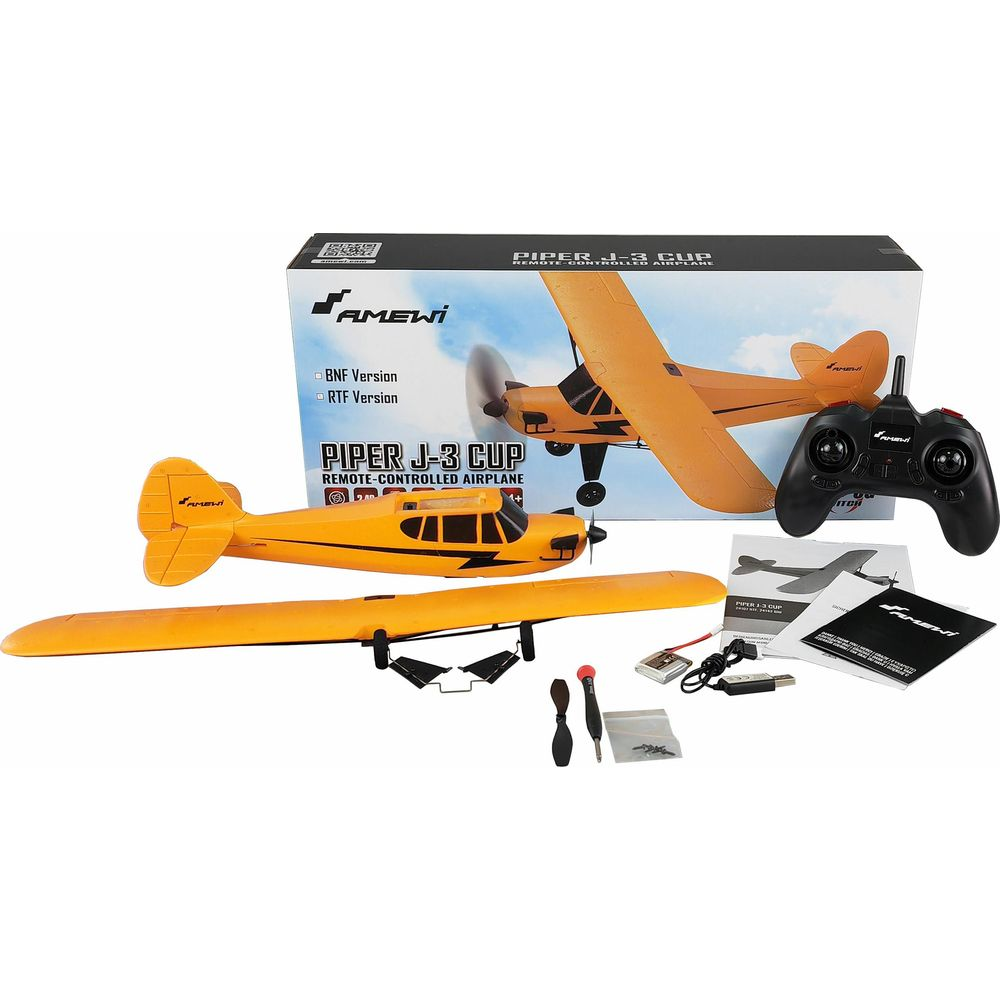 Un aereo giallo telecomandato con telecomando, accessori e scatola.