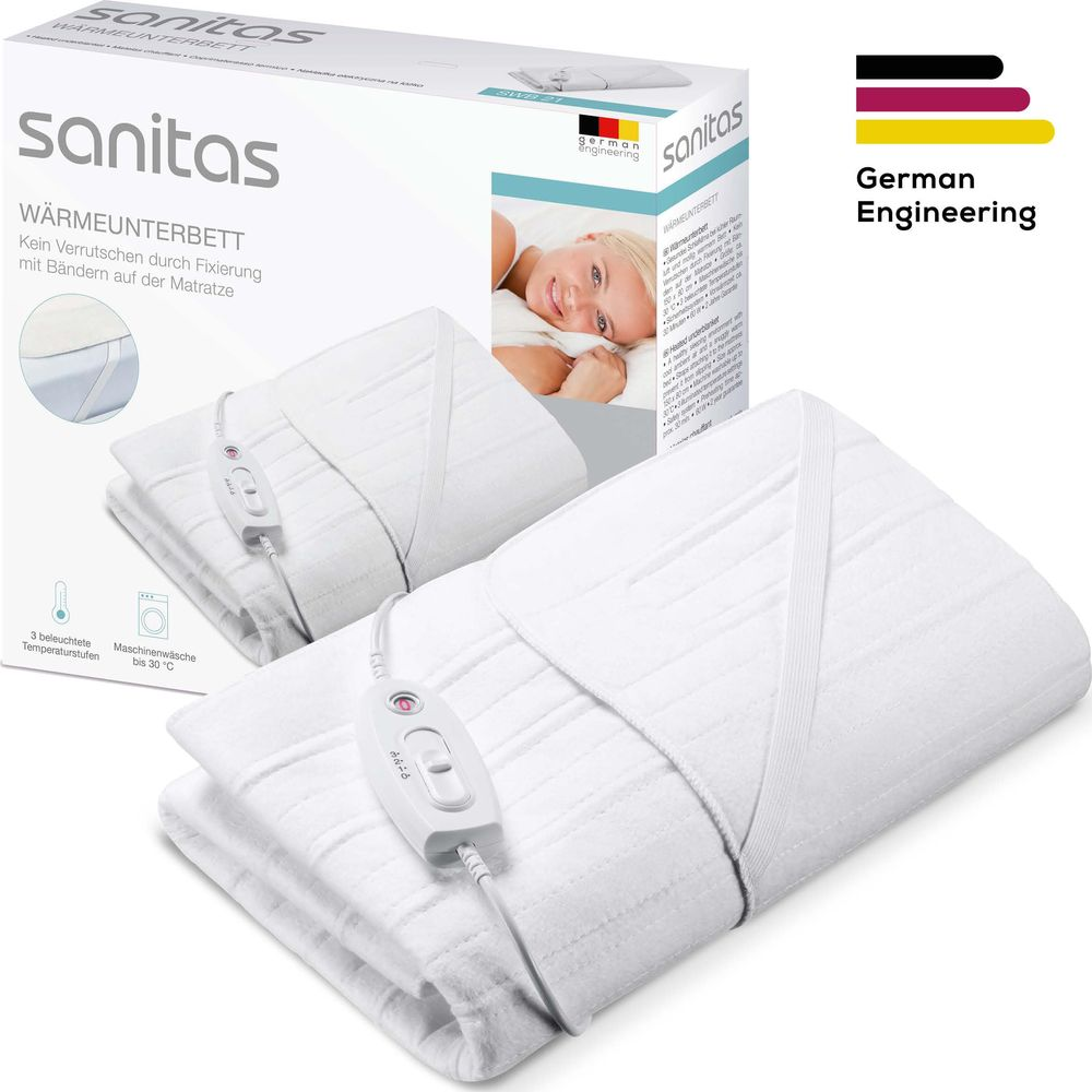 Ein weißes Sanitas Heizbett mit Fernbedienung und Verpackung.