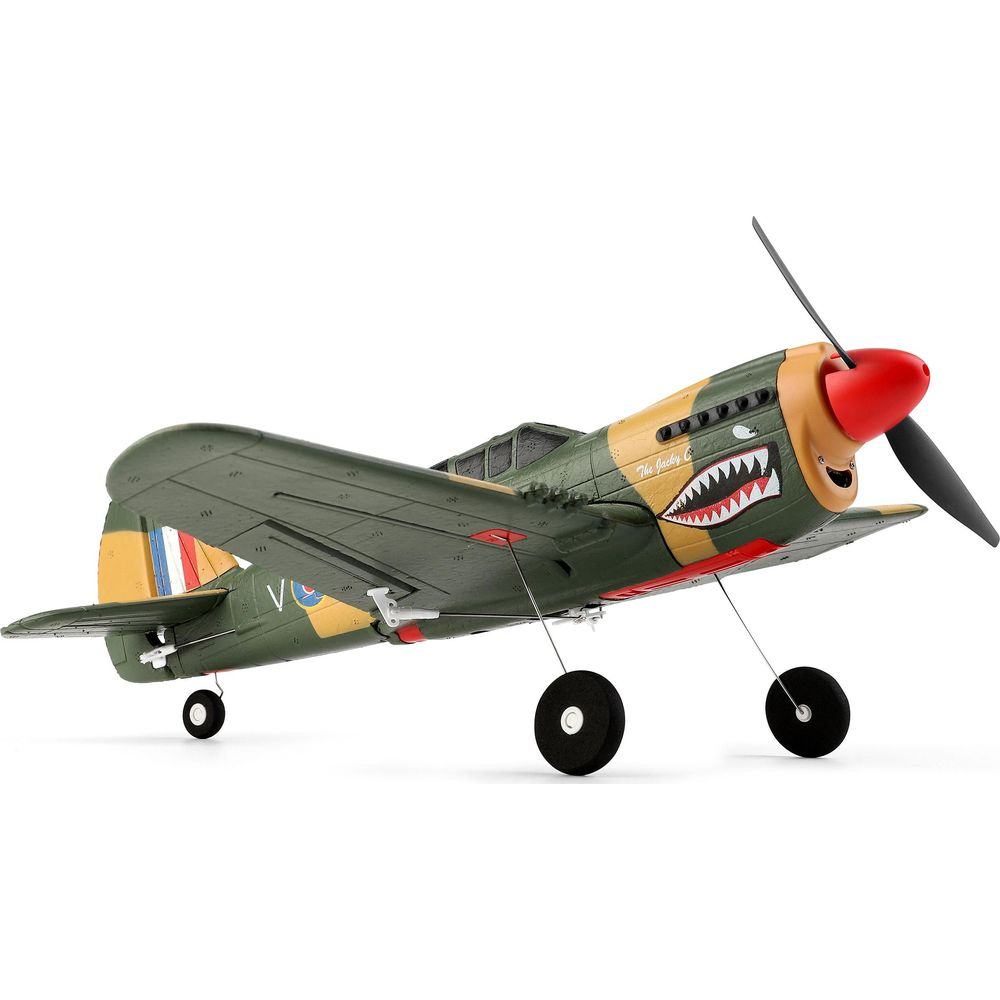Avion vert et jaune avec hélice rouge et détail de gueule de requin.
