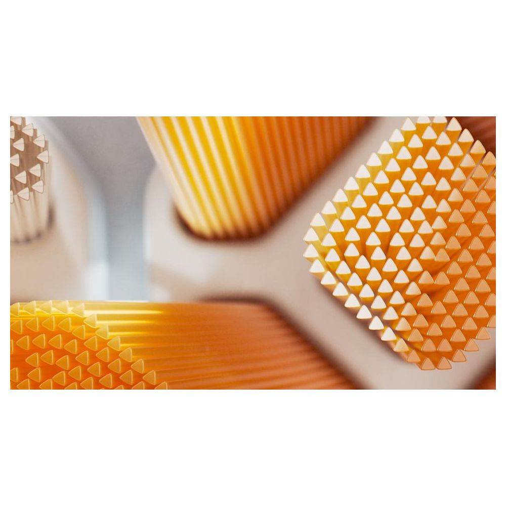 Primer plano de cerdas de cepillo de dientes naranjas dispuestas en filas.