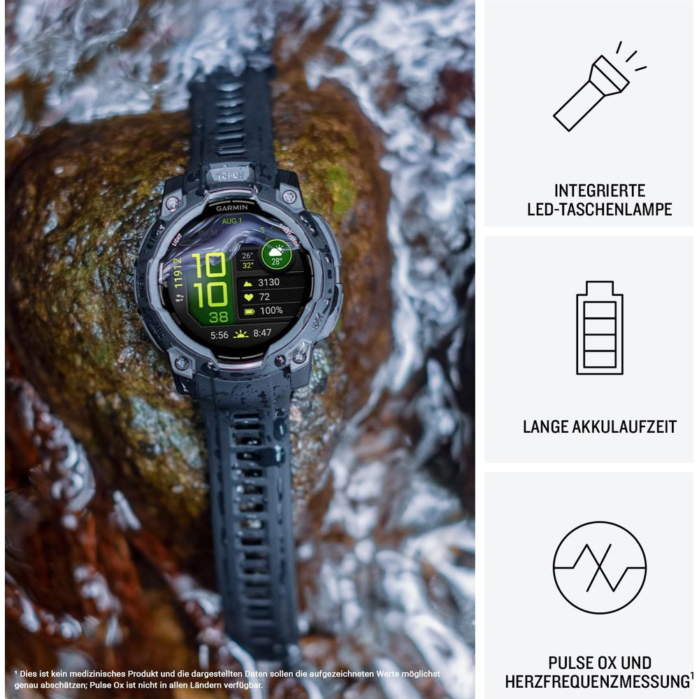 Graue Garmin Smartwatch mit detailliertem Display auf einem Stein.