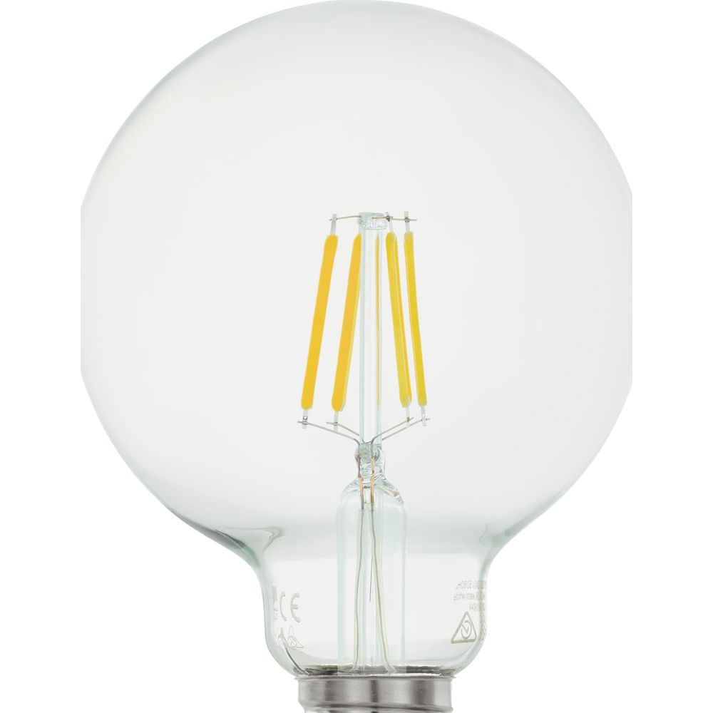Une ampoule transparente avec des filaments jaunes au centre.