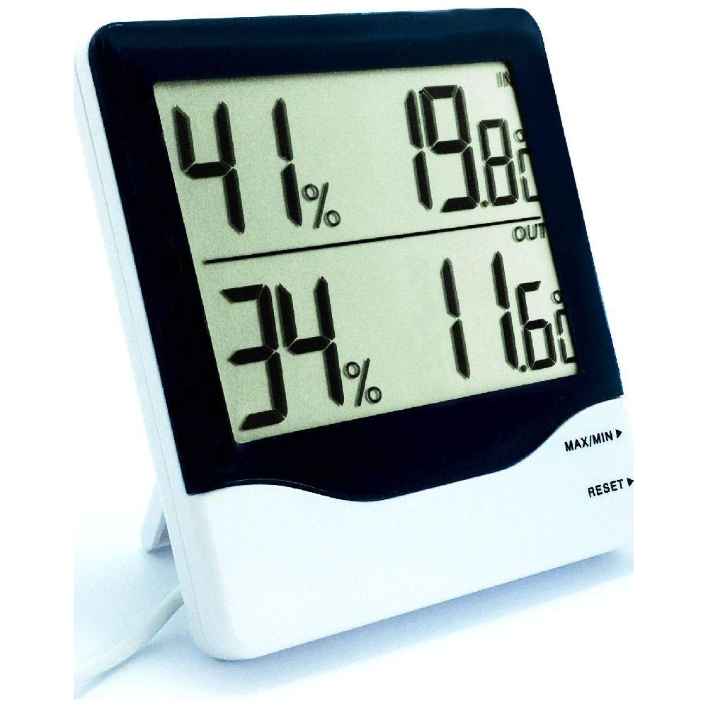 Ein digitaler Thermometer/Hygrometer zeigt 41% innen und 34% außen an.