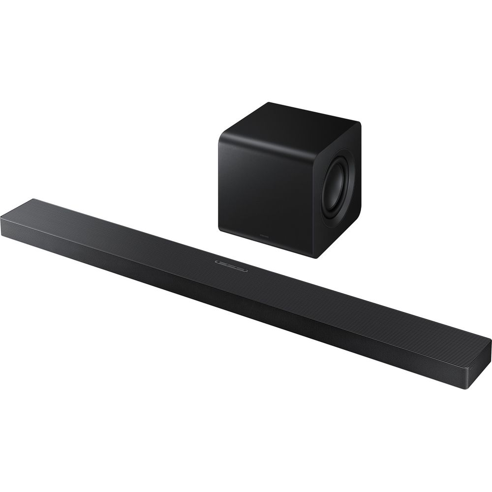 Barre de son et caisson de basses noirs sur fond blanc.