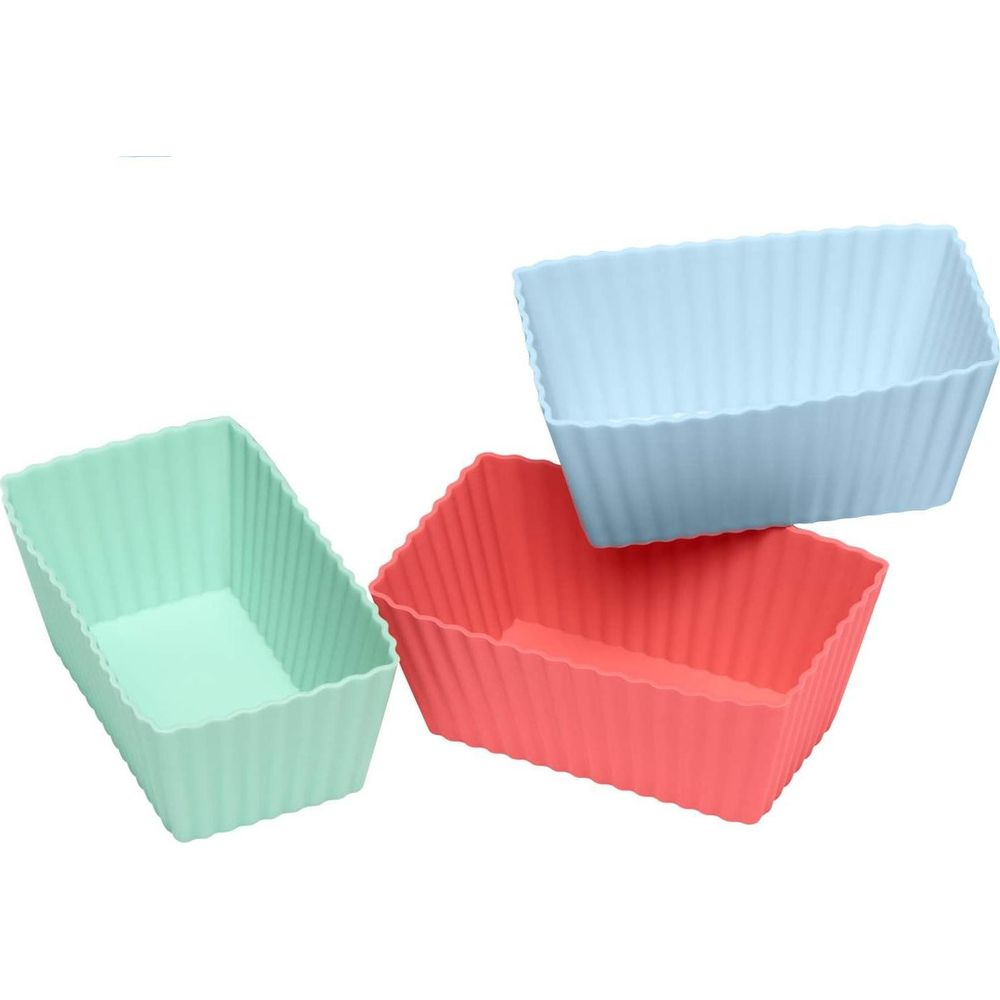 Trzy prostokątne silikonowe formy w kolorze miętowym, koralowym i niebieskim.