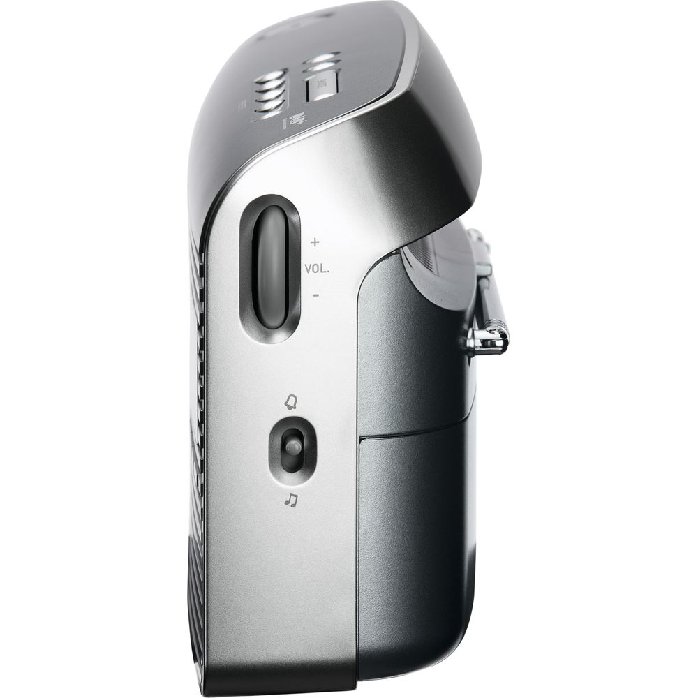 Srebrne radio przenośne z przyciskami głośności i włącznikiem.